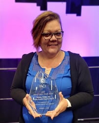 Mindy Wilds with Award